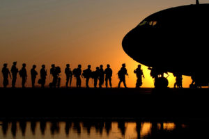 Soldiers wait in line to board an aircraft Nov. 17 at Joint Base Balad, Iraq. (U.S. Air Force photo/Tech. Sgt. Erik Gudmundson)